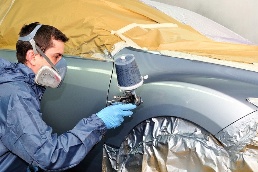 Paint tech painting a car